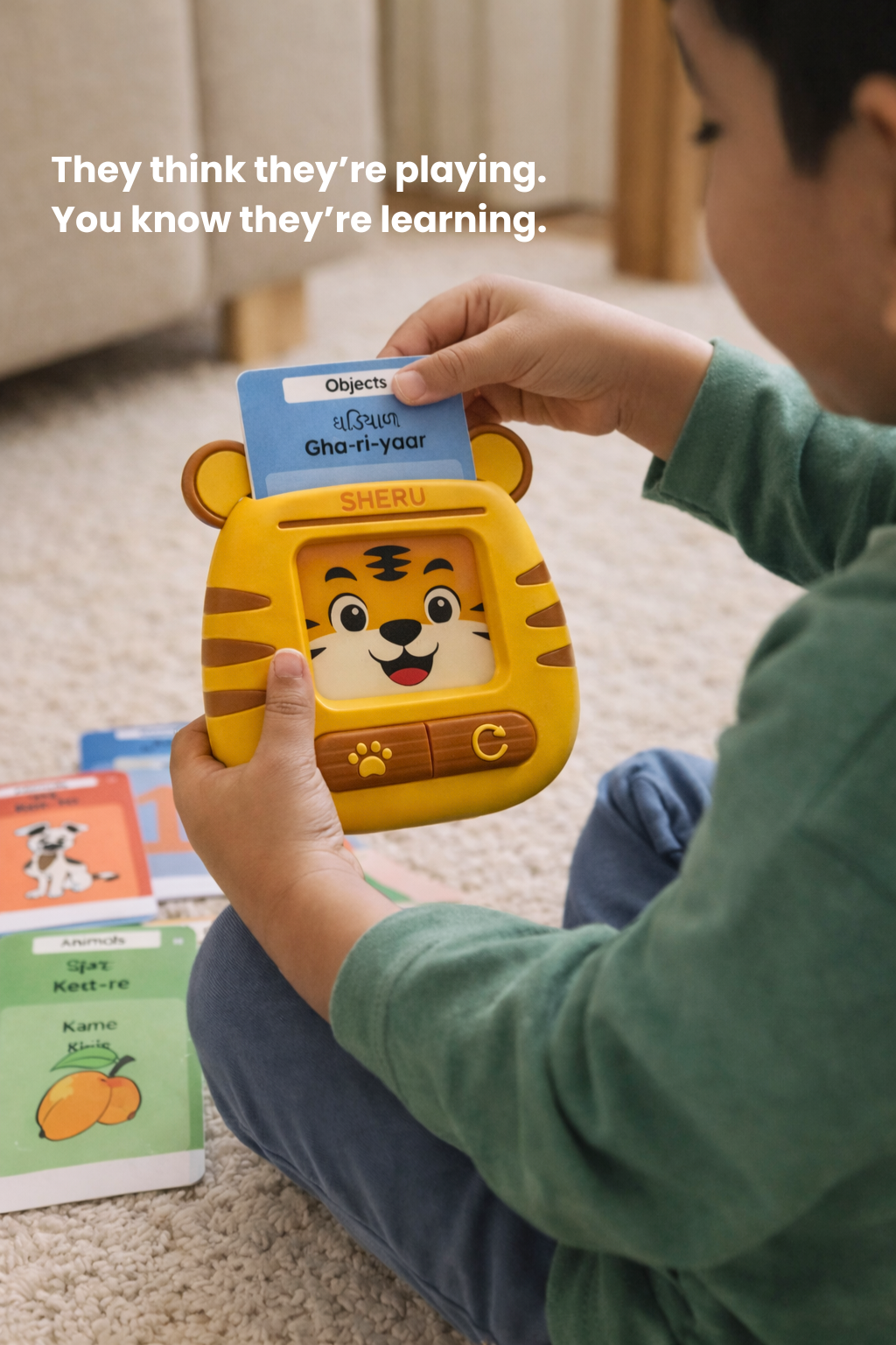 Child playing with Sheru the Tiger Indian language learning toy ages 2 to 6